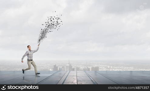 Man running with book. Funny student guy running with opened book in hand