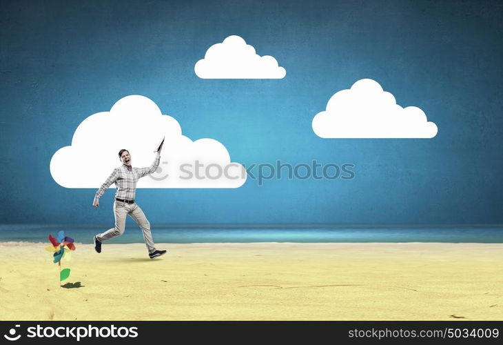 Man running with book. Screaming student guy running with opened book in hand