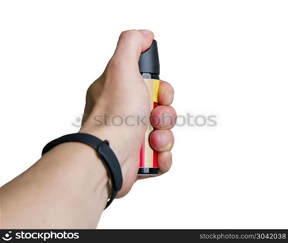 man?s hand holds a can of tear gas ahead of him isolated on white background. hand hold gas. hand hold gas