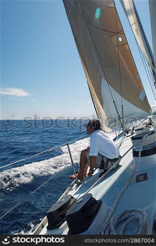 Man Sailing on Yacht