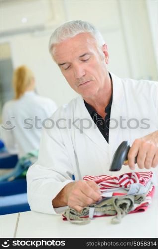 Man scanning garment