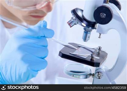 Man scientist. Image of man scientist working in laboratory with microscope