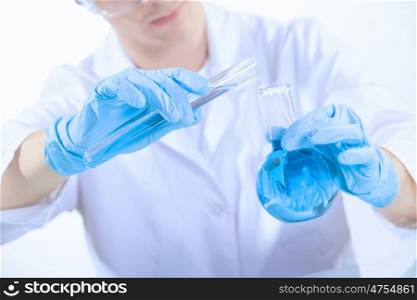 Man scientist. Image of man scientist working in laboratory with testing tubes