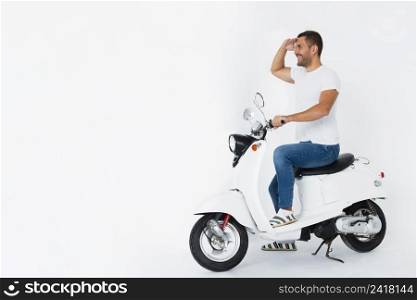 man scooter looking away long shot