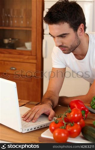 Man searching recipe on the Internet