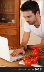 Man searching recipe on the Internet