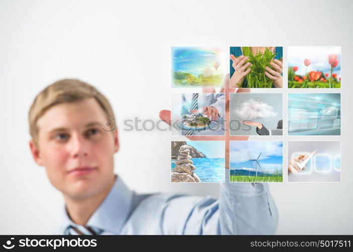 Man selecting tv channel on virtual touch screen