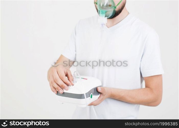 man setting medical nebulizer
