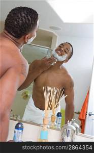 Man Shaving in Mirror