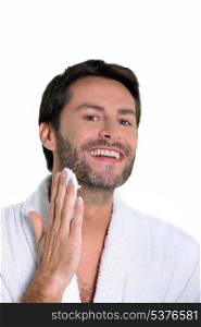 man shaving off his beard