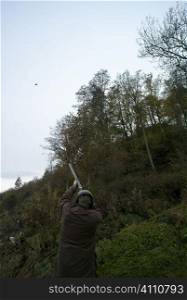 Man shooting grouse, Berwickshire, Scotland