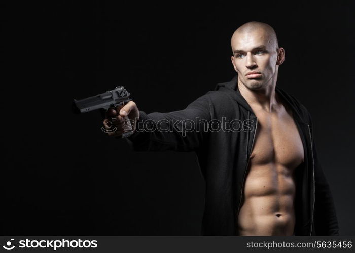 man shooting gun isolated on black background