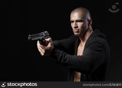 man shooting gun isolated on black background