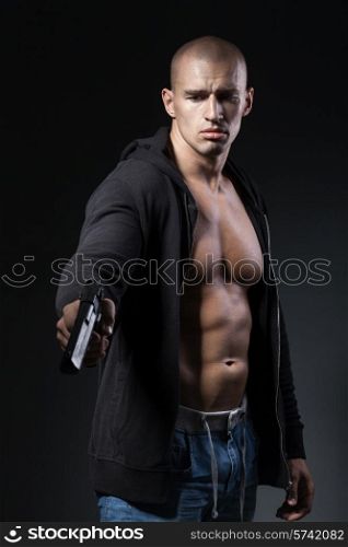 man shooting gun isolated on black background