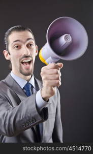 Man shouting and yelling with loudspeaker