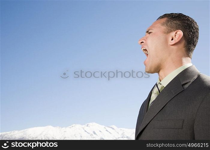 Man shouting near mountains