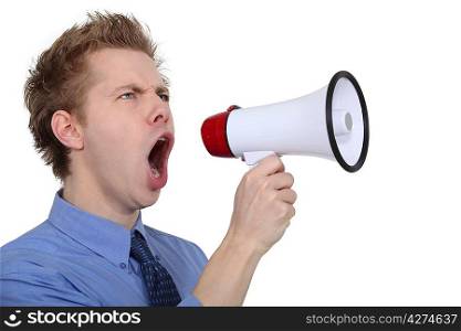 man shouting through a megaphone