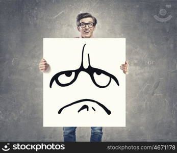 Man show banner with upset smiley. Businessman hold white board with sad face emoticon