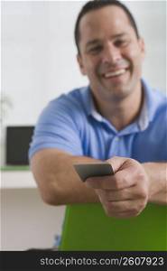 Man showing a credit card
