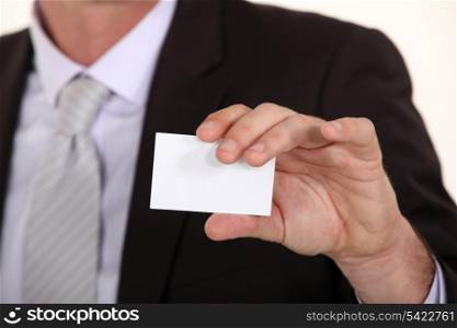 Man showing empty business card
