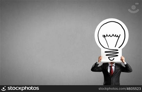 Man showing idea banner. Unrecognizable businessman holding light bulb paper concept