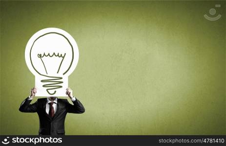 Man showing idea banner. Unrecognizable businessman holding light bulb paper concept