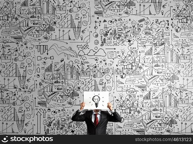 Man showing paper sheet. Unrecognizable businessman holding paper covering her face