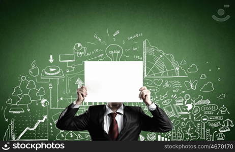 Man showing paper sheet. Unrecognizable businessman holding paper covering her face