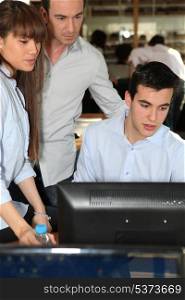 Man showing project to colleagues at work