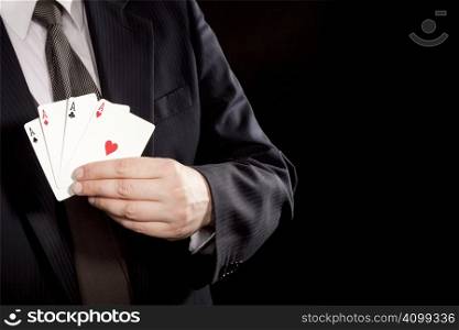 Man showing winning hand with four aces