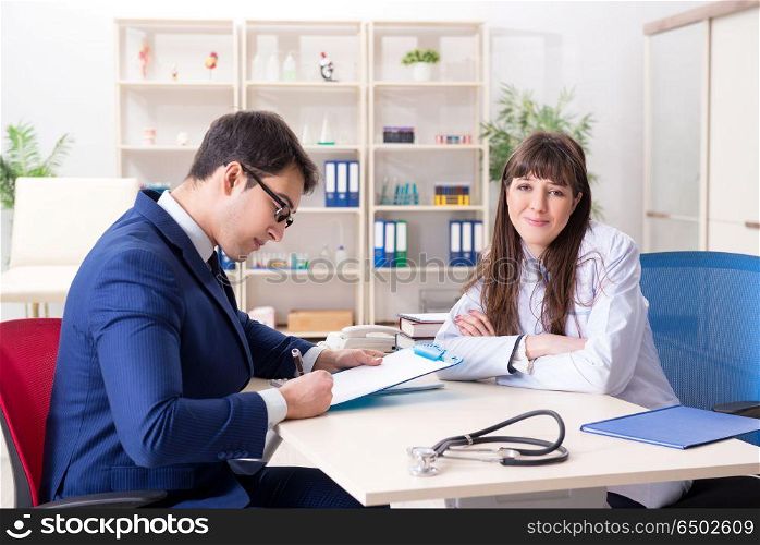 Man signing medical insurance contract