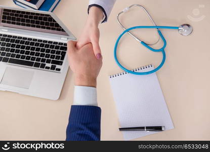 Man signing medical insurance contract