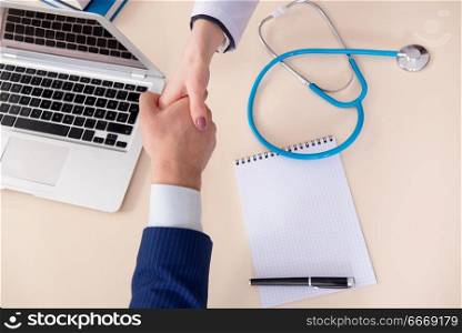 Man signing medical insurance contract