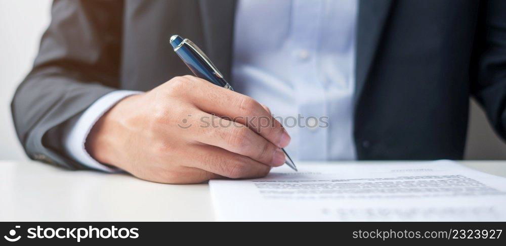 man signing on contract documents after reading, man holding pen and approve on business report. Contract agreement, law and deal concepts