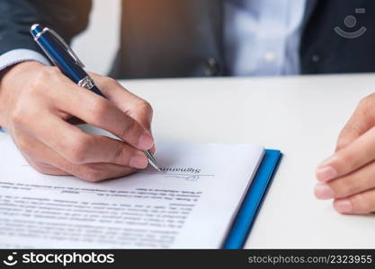 man signing on contract documents after reading, man holding pen and approve on business report. Contract agreement, law and deal concepts