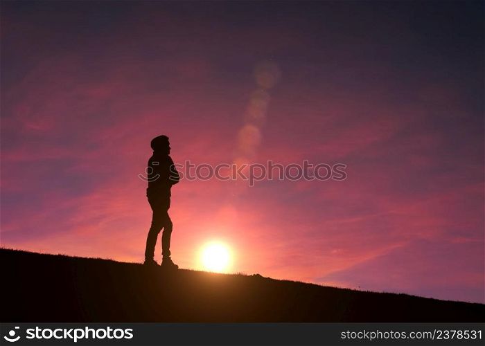 man silhouette in the mountain with a beautiful sunset background