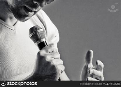 Man singing into a microphone