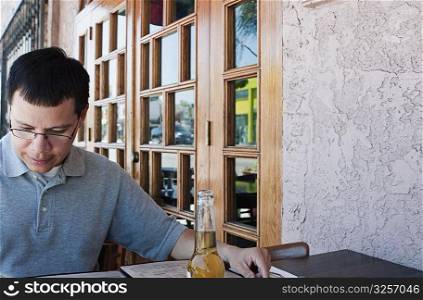 Man sitting at outdoor restaurant