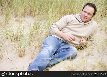 Man sitting back on beach