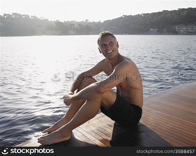 Man Sitting by Water