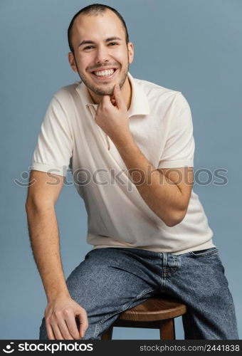 man sitting chair laughing