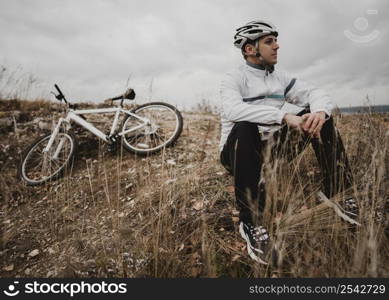 man sitting grass his mountain bike 2