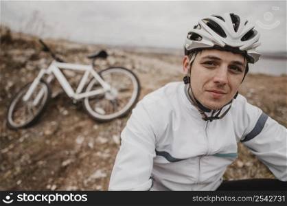 man sitting grass his mountain bike