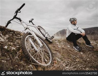 man sitting grass his mountain bike 3