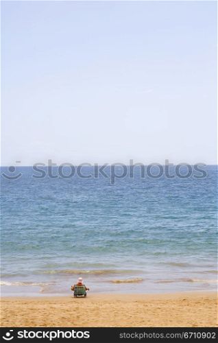Man sitting on a beach