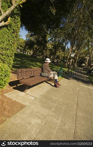 Man sitting on a bench in a park