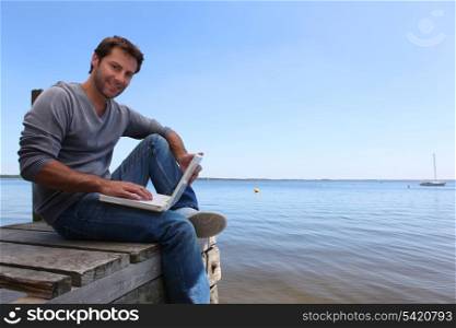 Man sitting on a jetty