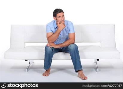 Man sitting on a sofa