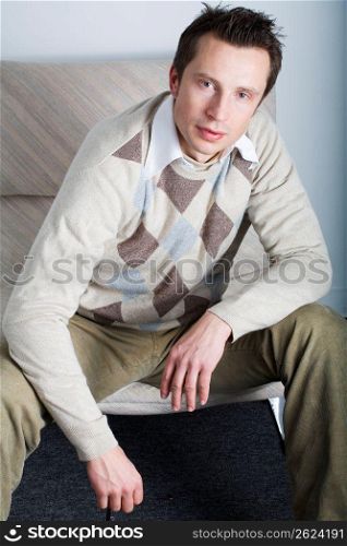 Man sitting on sofa, portrait
