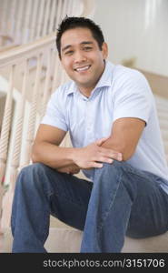 Man sitting on staircase smiling